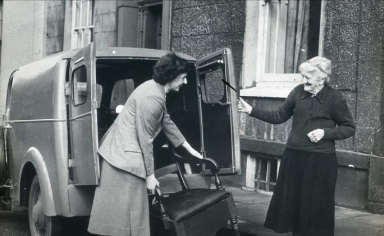 An archive image of a member of the Old People's Welfare Committee in the 1940s.