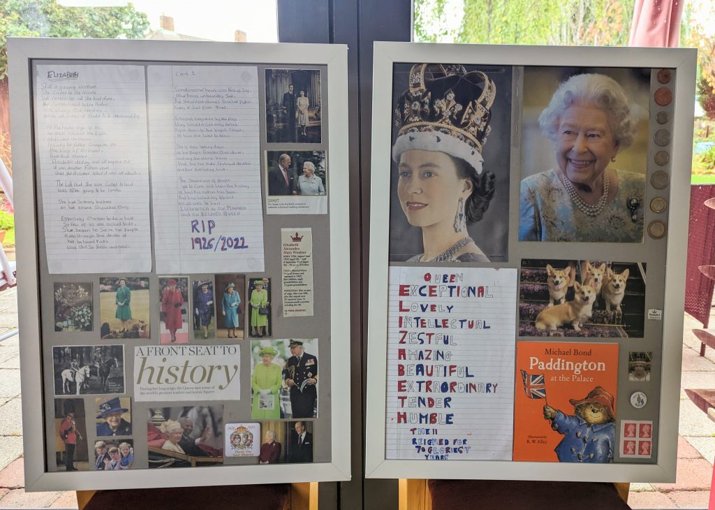Two large framed art pieces dedicated to Queen Elizabeth II.