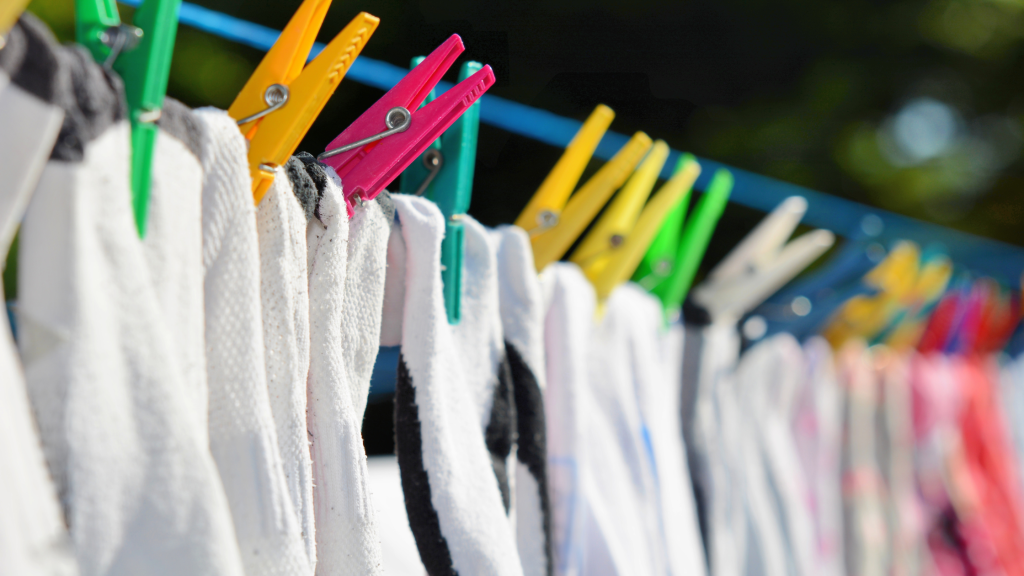 Socks hanging on a washing line.